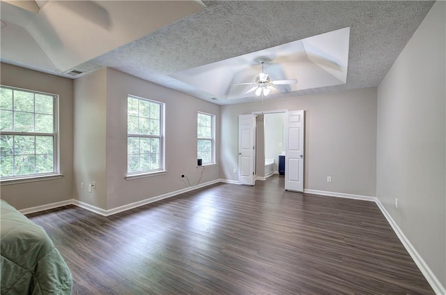 4975 Rockstone Way, Acworth, GA 30101 - bedroom with dark wood finished floors, a tray ceiling, and a ceiling fan