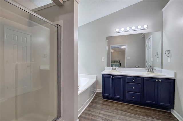 4975 Rockstone Way, Acworth, GA 30101 - full bath featuring a shower stall, a bath, double vanity, and wood finished floors