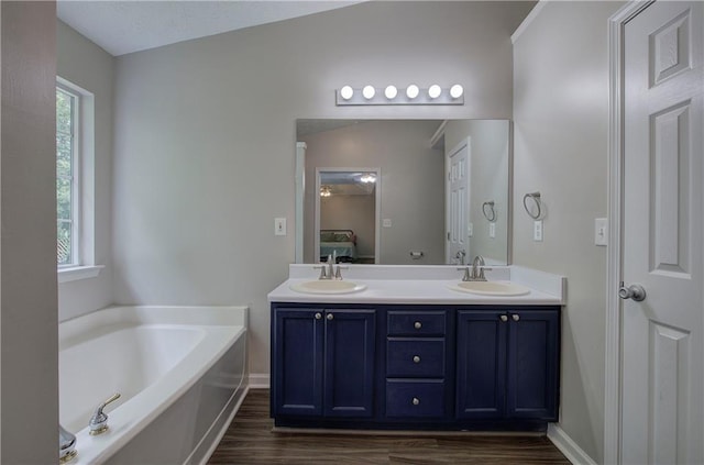 4975 Rockstone Way, Acworth, GA 30101 - bathroom featuring wood finished floors, double vanity, a bath, and ensuite bath