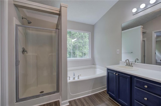 4975 Rockstone Way, Acworth, GA 30101 - bathroom featuring wood finished floors, a bath, a stall shower, and vanity