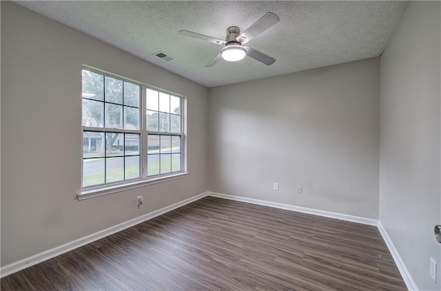 4975 Rockstone Way, Acworth, GA 30101 - empty room featuring dark wood-style flooring, a textured ceiling, and a ceiling fan
