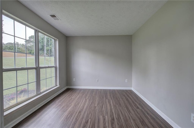 4975 Rockstone Way, Acworth, GA 30101 - unfurnished room featuring dark wood-style flooring and a textured ceiling