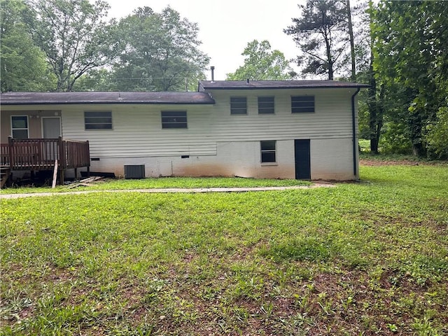 1681 SW Hammond Woods Cir SW, Marietta, GA 30008 - rear view of house featuring crawl space, a yard, central AC, and a deck