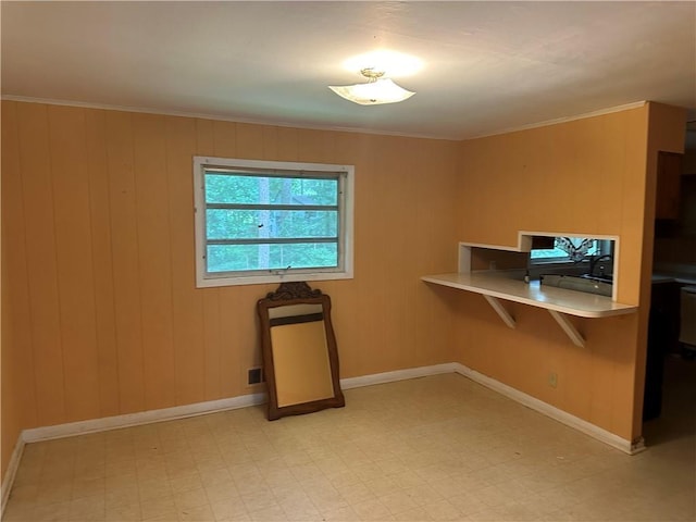 1681 SW Hammond Woods Cir SW, Marietta, GA 30008 - unfurnished dining area with light floors, baseboards, crown molding, and wooden walls