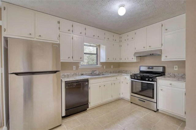 kitchen featuring light countertops, appliances with stainless steel finishes, white cabinets, a sink, and under cabinet range hood