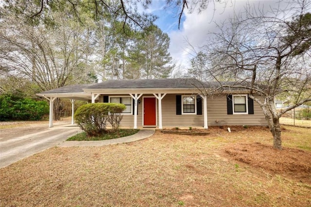 single story home featuring a carport, driveway, and a front lawn