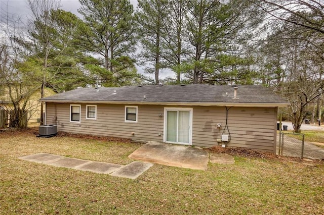 back of property with a yard, a patio, cooling unit, and fence