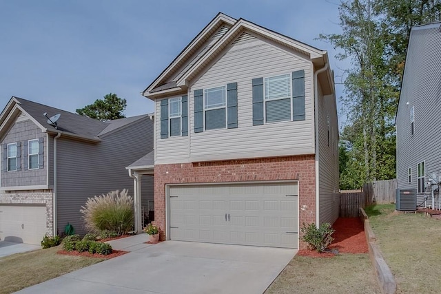 view of front facade with a garage, central AC unit, and a front lawn