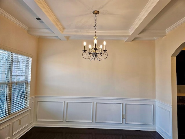 empty room with coffered ceiling, beamed ceiling, and an inviting chandelier