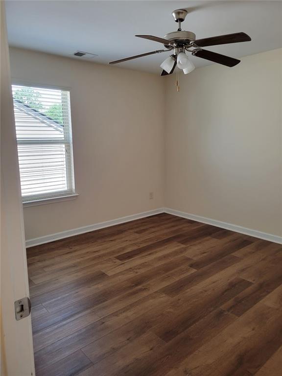 spacious closet with dark hardwood / wood-style floors