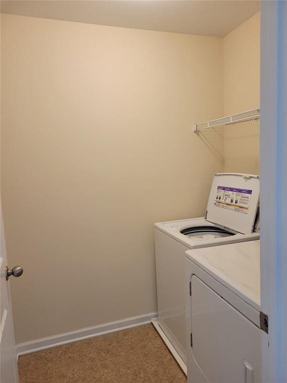 laundry area with washing machine and dryer