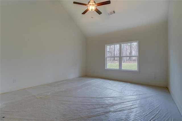 empty room featuring high vaulted ceiling, ceiling fan, visible vents, and baseboards