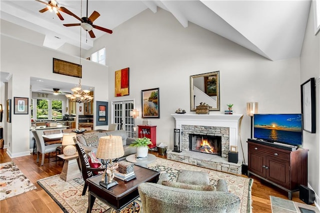 2176 Pine Lake Rd, Hiawassee, GA 30546 - living room with ceiling fan, a fireplace, high vaulted ceiling, a chandelier, and wood finished floors