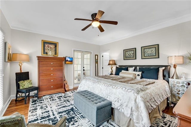 2176 Pine Lake Rd, Hiawassee, GA 30546 - bedroom featuring crown molding, wood finished floors, baseboards, and ceiling fan