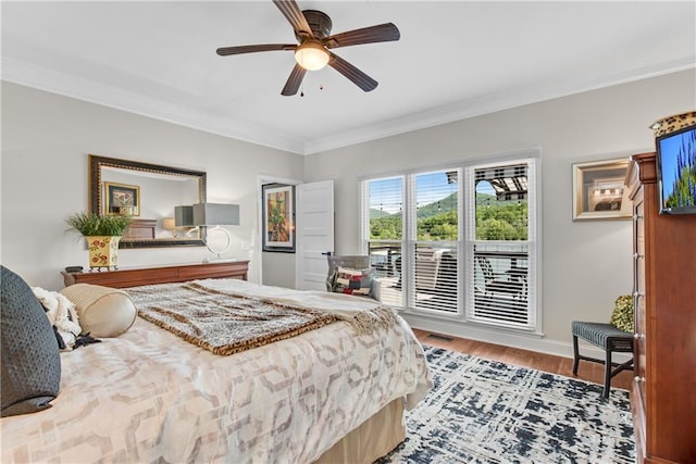 2176 Pine Lake Rd, Hiawassee, GA 30546 - bedroom with crown molding, wood finished floors, and a ceiling fan