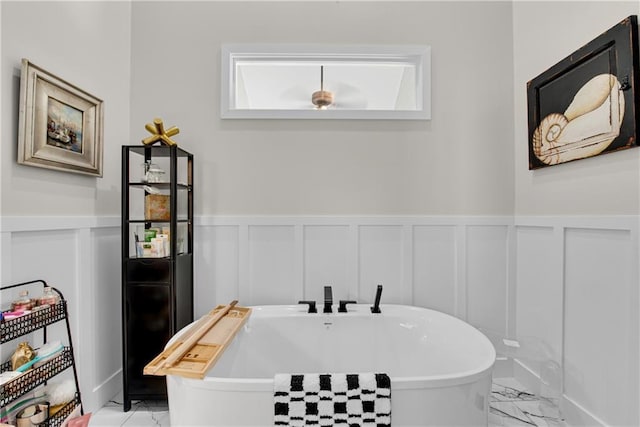 2176 Pine Lake Rd, Hiawassee, GA 30546 - full bathroom with marble finish flooring, a decorative wall, a freestanding tub, and wainscoting