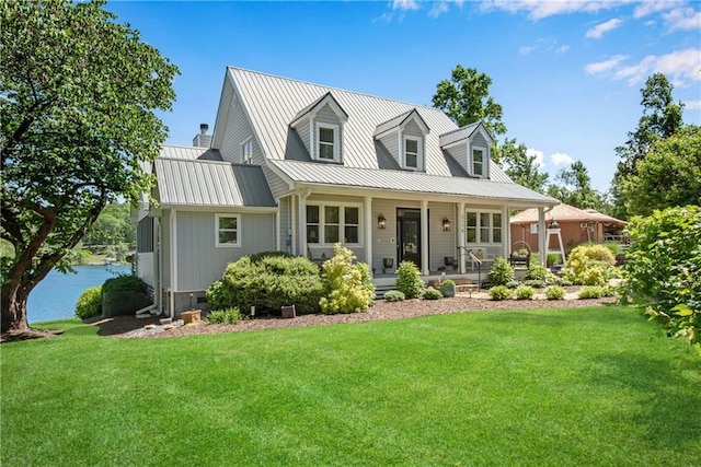 2176 Pine Lake Rd, Hiawassee, GA 30546 - cape cod house featuring metal roof, a front yard, and covered porch