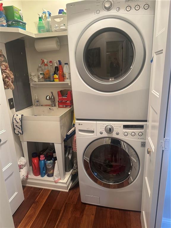 2176 Pine Lake Rd, Hiawassee, GA 30546 - laundry room with stacked washing machine and dryer and dark wood-style floors
