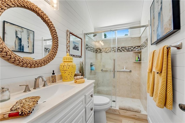 2176 Pine Lake Rd, Hiawassee, GA 30546 - bathroom featuring a stall shower, toilet, vanity, and wood finished floors