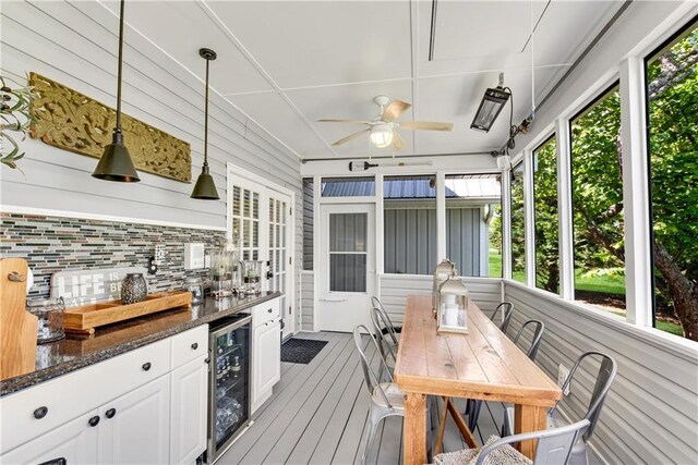 2176 Pine Lake Rd, Hiawassee, GA 30546 - sunroom / solarium with beverage cooler, ceiling fan, outdoor dining space, and an outdoor kitchen