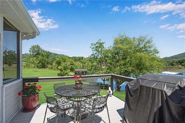 2176 Pine Lake Rd, Hiawassee, GA 30546 - wooden terrace featuring a grill, a yard, and outdoor dining area