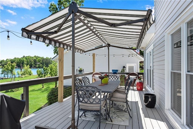 2176 Pine Lake Rd, Hiawassee, GA 30546 - wooden terrace with outdoor dining area, a water view, and a lawn