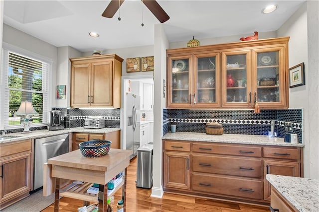 2176 Pine Lake Rd, Hiawassee, GA 30546 - kitchen with stainless steel dishwasher, fridge with ice dispenser, a ceiling fan, decorative backsplash, and recessed lighting