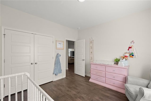 bedroom featuring a closet and dark hardwood / wood-style floors