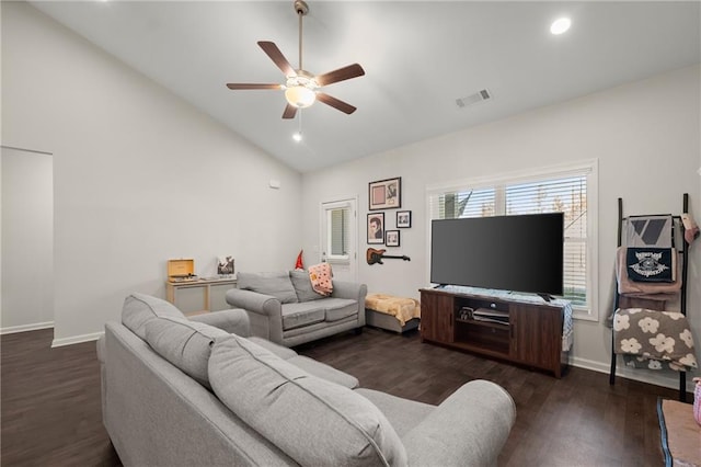 living room with ceiling fan, dark hardwood / wood-style flooring, and vaulted ceiling