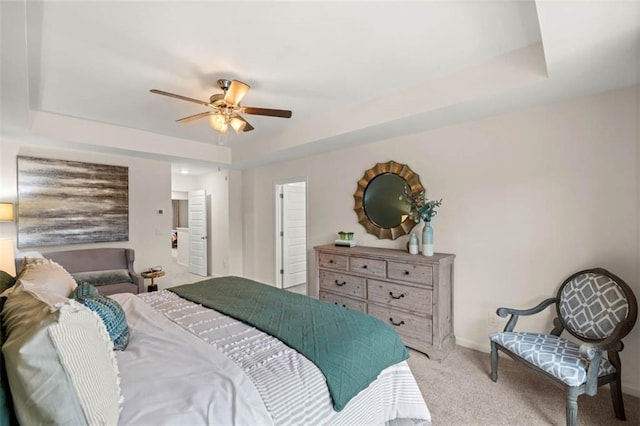 353 Sound Cir, Stockbridge, GA 30281 - carpeted bedroom featuring a raised ceiling, baseboards, and ceiling fan