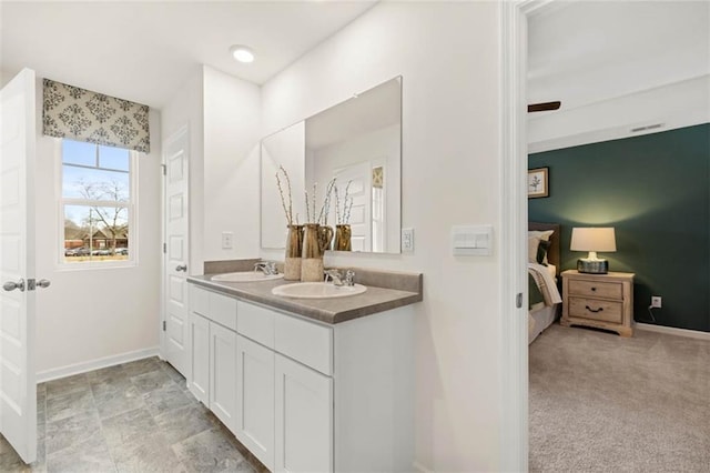 353 Sound Cir, Stockbridge, GA 30281 - ensuite bathroom with ensuite bathroom, baseboards, and a sink