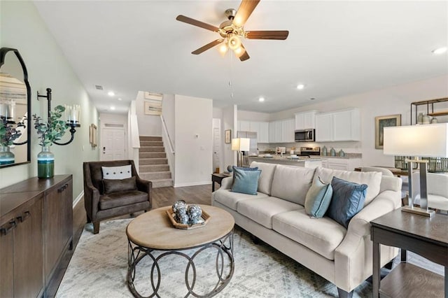 353 Sound Cir, Stockbridge, GA 30281 - living room with baseboards, recessed lighting, stairs, and ceiling fan