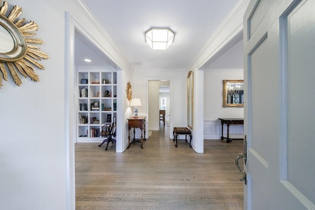 foyer featuring ornamental molding and wood-type flooring