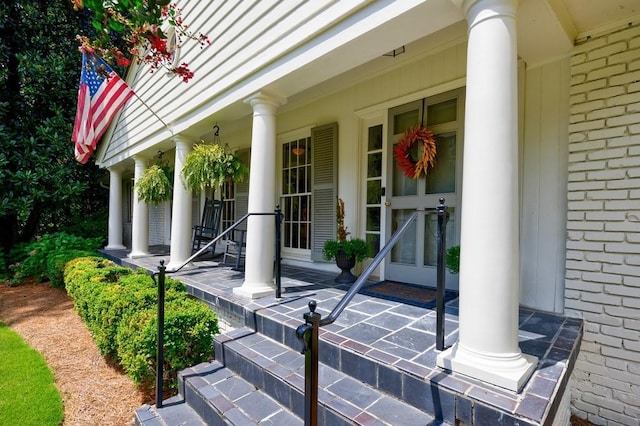 entrance to property featuring a porch