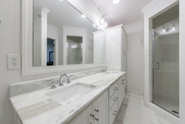 bathroom with a shower with shower door, vanity, tile patterned floors, and ornamental molding