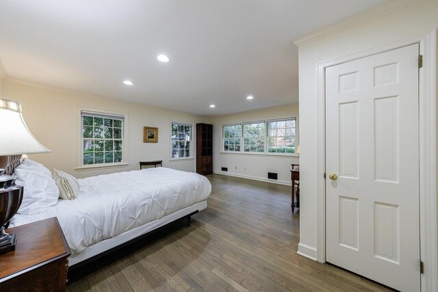 bedroom featuring wood-type flooring and ornamental molding