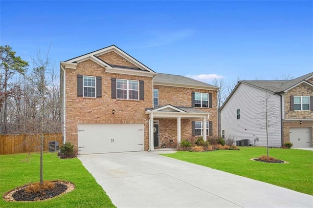 craftsman-style home with cooling unit, a garage, and a front yard