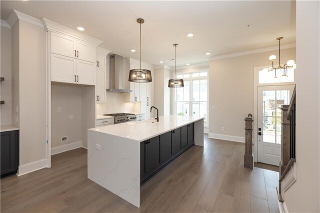 530 Fisher Dr Unit 45, Alpharetta, GA 30009 - kitchen with wall chimney exhaust hood, dark wood-type flooring, white cabinetry, baseboards, and an island with sink
