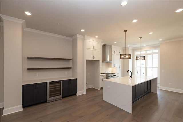 530 Fisher Dr Unit 45, Alpharetta, GA 30009 - kitchen featuring beverage cooler, wall chimney exhaust hood, white cabinets, ornamental molding, and a large island