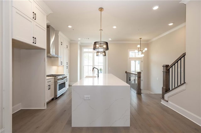 530 Fisher Dr Unit 45, Alpharetta, GA 30009 - kitchen featuring stainless steel range, wall chimney range hood, wood finished floors, white cabinetry, and a sink