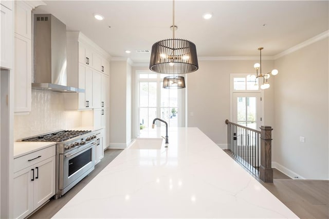 530 Fisher Dr Unit 45, Alpharetta, GA 30009 - kitchen with wall chimney range hood, high end stainless steel range, a chandelier, a sink, and white cabinets