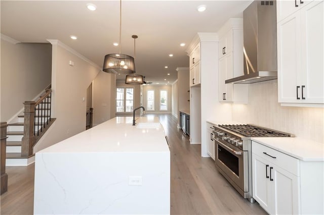 530 Fisher Dr Unit 45, Alpharetta, GA 30009 - kitchen featuring high end stainless steel range, a sink, wall chimney range hood, light wood-type flooring, and recessed lighting