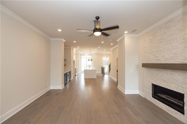 530 Fisher Dr Unit 45, Alpharetta, GA 30009 - unfurnished living room with ceiling fan, a fireplace, ornamental molding, baseboards, and wood finished floors