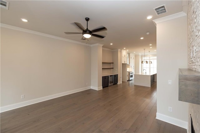 530 Fisher Dr Unit 45, Alpharetta, GA 30009 - unfurnished living room with ornamental molding, a ceiling fan, dark wood finished floors, recessed lighting, and baseboards