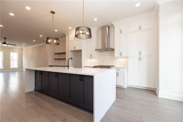 530 Fisher Dr Unit 45, Alpharetta, GA 30009 - kitchen with wall chimney range hood, white cabinets, light wood-style floors, light countertops, and recessed lighting