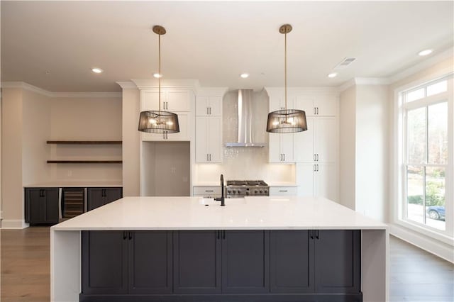 530 Fisher Dr Unit 45, Alpharetta, GA 30009 - kitchen featuring wall chimney exhaust hood, beverage cooler, range, baseboards, and white cabinetry
