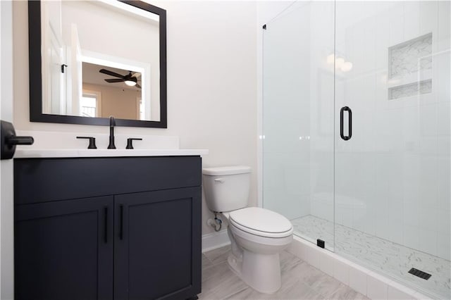 530 Fisher Dr Unit 45, Alpharetta, GA 30009 - bathroom featuring toilet, vanity, a stall shower, a ceiling fan, and baseboards