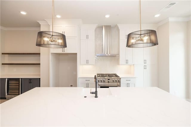530 Fisher Dr Unit 45, Alpharetta, GA 30009 - kitchen with wall chimney range hood, beverage cooler, high end stove, crown molding, and white cabinetry