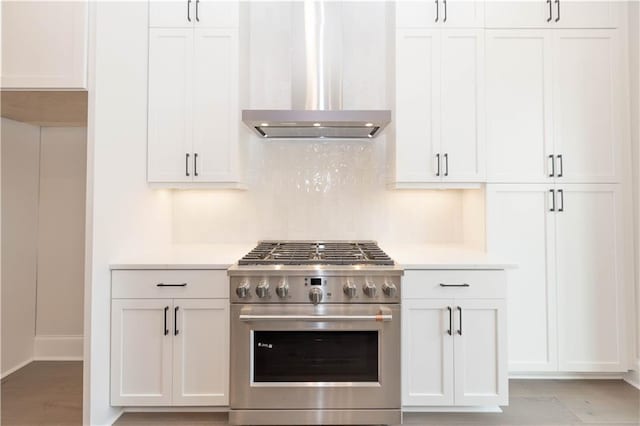 530 Fisher Dr Unit 45, Alpharetta, GA 30009 - kitchen with stainless steel range, wall chimney exhaust hood, light countertops, and white cabinetry