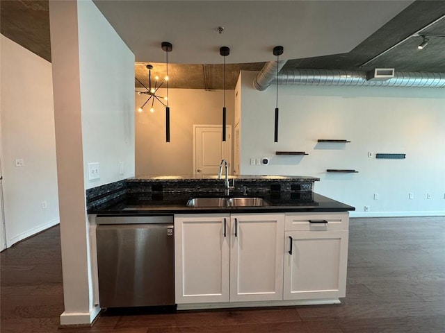 kitchen with white cabinets, sink, hanging light fixtures, stainless steel dishwasher, and dark hardwood / wood-style flooring